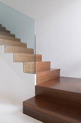 wooden stairs detail with hardened glass balustrade